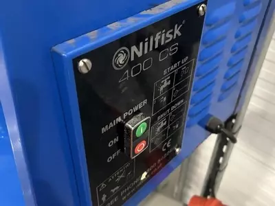 Control panel on a Nilfisk DTE wall-mounted static pressure washer before contactor and overload replacement repair.